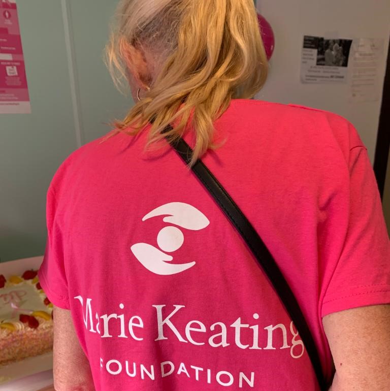 Staff member wearing Marie Keating tshirt